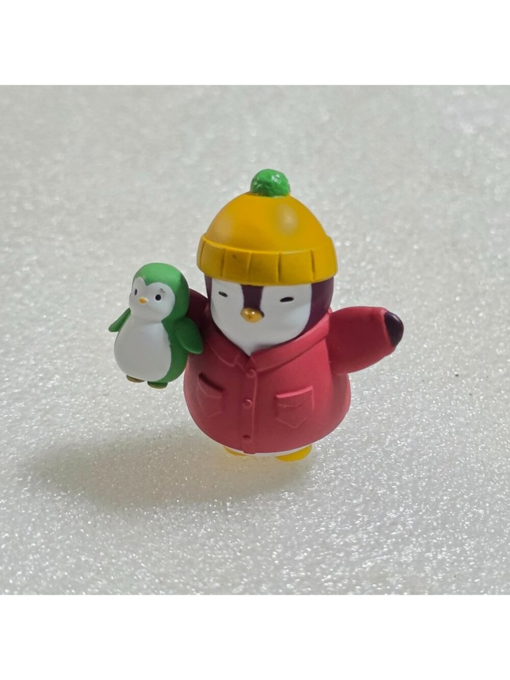 Pudgy Penguins Igloo Pack Collectible Figure Red Jacket carrying smaller 2"